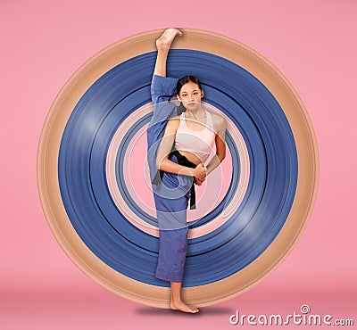 12-15 years old Asian Youth stretch lift up her flexible leg full length Stock Photo