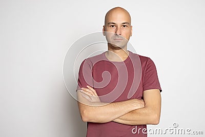 40 years old bald man in t-shirt isolated on grey Stock Photo