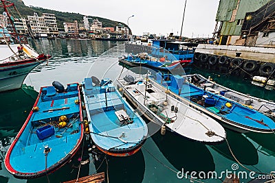 Yehliu fishing harbor with fisherman boats floating on the river in fisherman village in northern Taipei Editorial Stock Photo