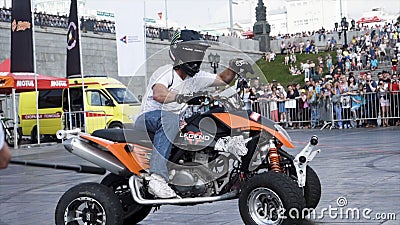 Yekaterinburg, Russia-August, 2019: Man on Quad bike performs tricks. Action. Professional freestyle biker maneuvers in Editorial Stock Photo