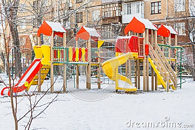 Yekaterinburg, Sverdlovsk Russia - 29 10 2018: A children`s playground with colored red blue yellow wooden houses and slides with Editorial Stock Photo