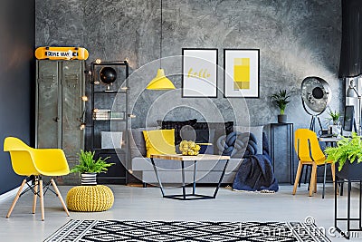Yellow accents and metal furniture Stock Photo