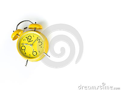 Yellow alarm Clock analog classic retro style on white backgroun Stock Photo