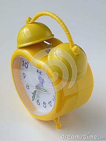 Yellow alarm clock Stock Photo