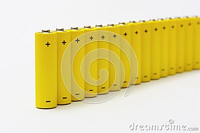 Yellow alkaline batteries row Stock Photo