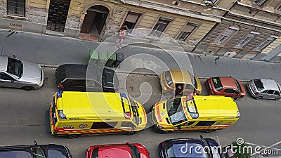 Yellow ambulances opposed to each other Editorial Stock Photo