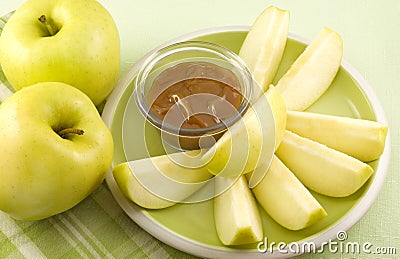 Yellow Apple Slices with Caramel Dip Stock Photo