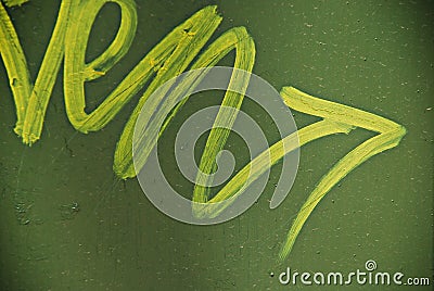 Yellow arrow on green background indicating right direction Stock Photo