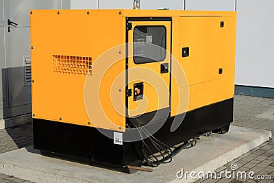 Yellow Auxiliary Diesel Generator for Emergency Electric Power Editorial Stock Photo