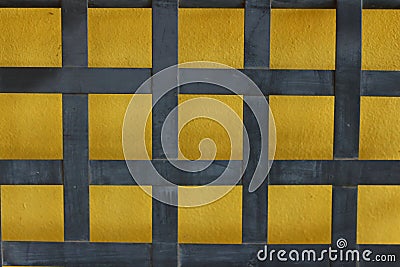 Yellow background with blue striped on a wall Stock Photo