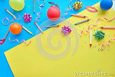 Yellow background, the concept of party time, an invitation to a birthday or other celebration. Stock Photo