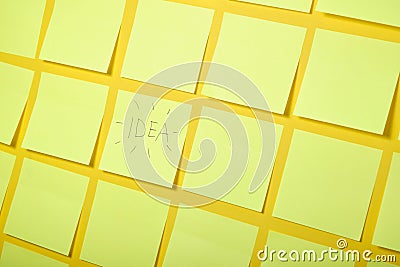 yellow background, one sticker with the words idea, brainstorming concept, selective focus Stock Photo