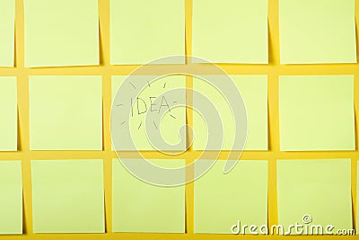 yellow background, one sticker with the words idea, brainstorming concept, selective focus Stock Photo