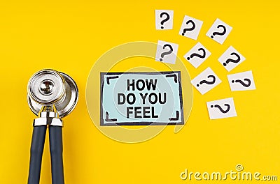 On a yellow background, a stethoscope, question marks and a sticker with the inscription - How Do You Feel Stock Photo