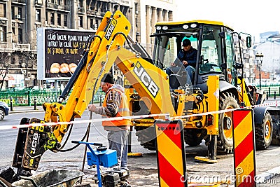 Yellow backhoe loader on construction site ready for working in Bucharest, Romania, 2020 Editorial Stock Photo