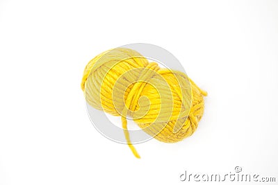Yellow ball of wool yarn for knitting close up on a white background. Stock Photo