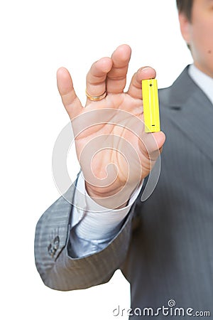 Yellow battery in hand Stock Photo