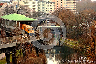 Yellow Berlin U-bahn exiting the station platform on a winter day. Editorial Stock Photo