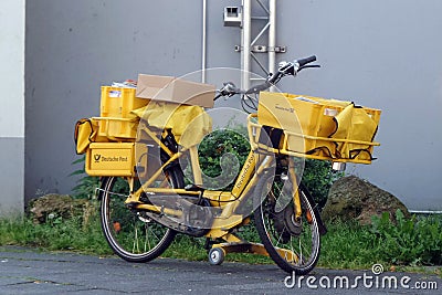 Yellow bicycle of a postman. Editorial Stock Photo