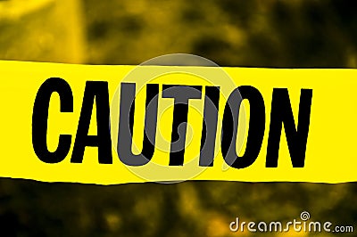 Yellow and Black Caution Tape Stock Photo