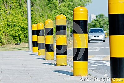 Yellow and black road safety posts Stock Photo