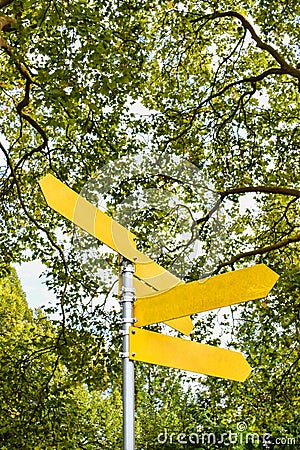 Yellow blank directional arrows on signpost. Stock Photo