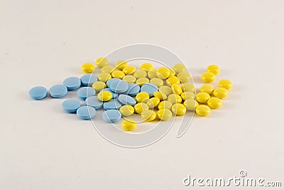 Yellow and Blue Pills Stock Photo