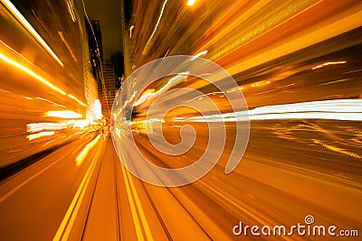 Yellow blurred reflections of a passing vehicle. Evening in the city with abstraction lines of lights Stock Photo