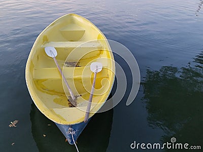 yellow Boat on the lake Stock Photo