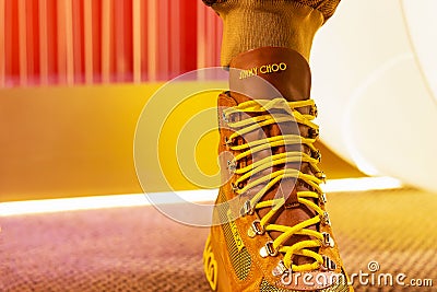 Yellow boots with lacing jimmy choo. fashion luxury collection .famous boutique Editorial Stock Photo