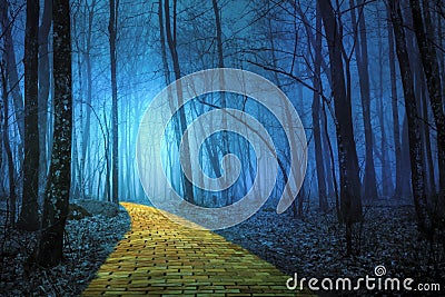 Yellow Brick Road leading through a spooky forest Stock Photo