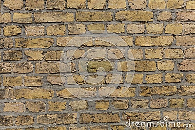 Yellow brown brick wall texture with light grey pointing Stock Photo