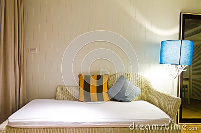 Yellow and brown pillow on sofa Stock Photo