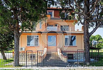 The yellow building of the Bulgarian National Institute of Meteorology and Hydrology, a branch office in Varna. Front view Editorial Stock Photo