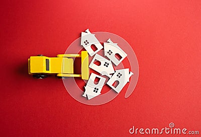 Yellow bulldozer demolishes houses. Pave the way for fresh perspectives. Stock Photo