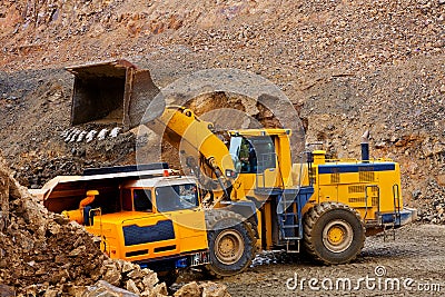 Yellow bulldozer and truck Editorial Stock Photo