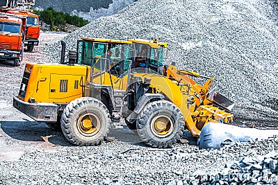 Yellow bulldozer working in quarry Editorial Stock Photo