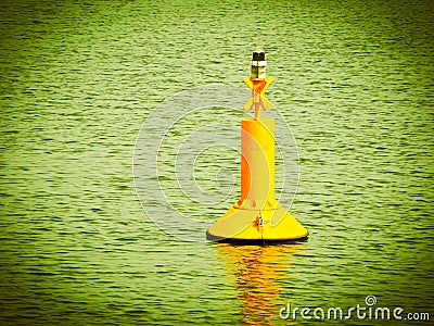 yellow buoy floating in the sea vintage retro Stock Photo