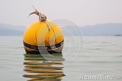 Yellow Buoy floats Stock Photo