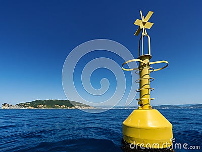 Yellow buoy on the ocean Stock Photo