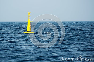 Yellow buoy on sea Stock Photo