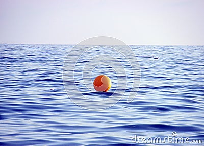 Yellow buoy on sea water Stock Photo