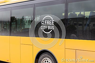 Yellow Bus with the inscription - Free City Bus Stock Photo