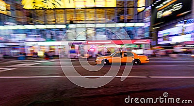 Yellow cab moving fast Stock Photo