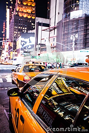 Yellow cab speeds through Times Square in New York. Editorial Stock Photo