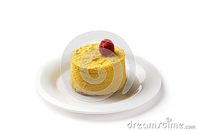 Yellow cake decorated with raspberry in a white plate isolated on white background Stock Photo