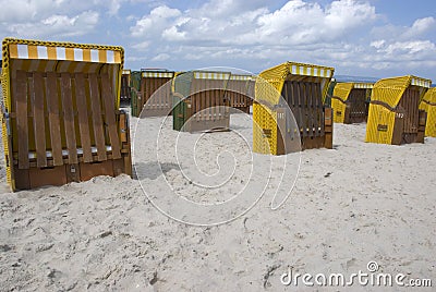 Yellow canopied beach chairs at Baltic Sea Stock Photo