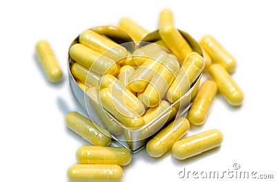 Yellow capsule heart Stock Photo