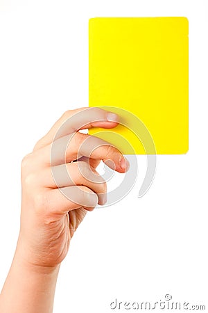 Yellow card in hand Stock Photo