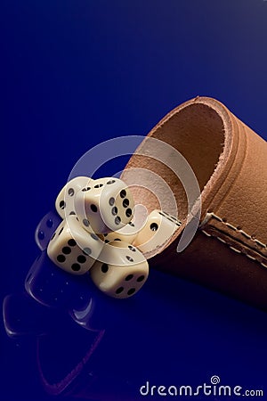 Yellow casino dice with cup Stock Photo